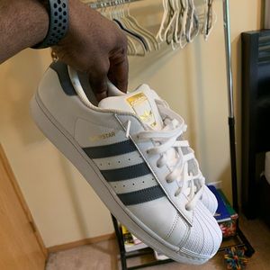 Shell toe adidas with gray three stripes